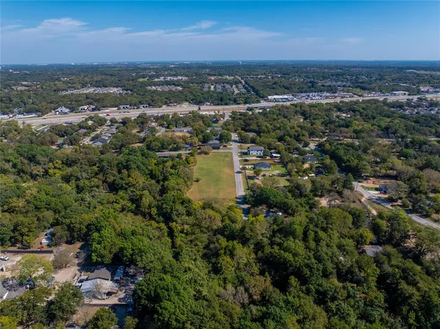 an aerial view of a city with lots of residential buildings