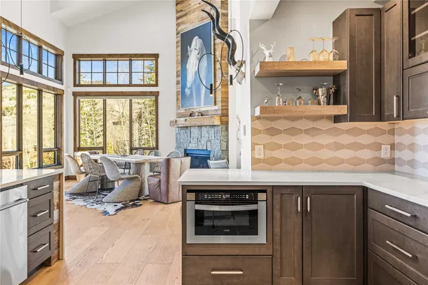 a kitchen with a table and chairs