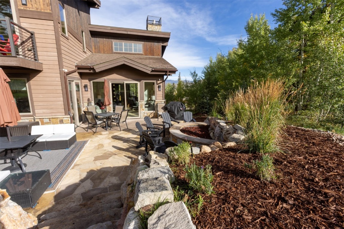 230 Game Trail Road Silverthorne, CO 80498 - Photo 12 of 46 a view of swimming pool with lawn chairs and plants
