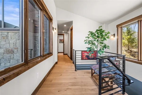a view of balcony with wooden floor and fence