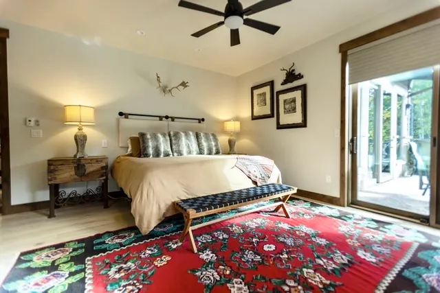 a bedroom with bed and a window