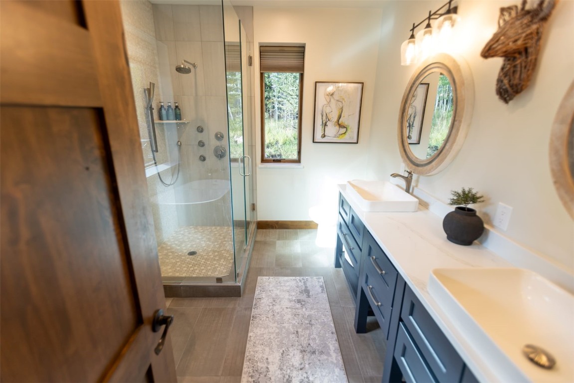 230 Game Trail Road Silverthorne, CO 80498 - Photo 21 of 46 a bathroom with a sink a toilet and a mirror