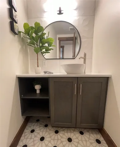 a closeup of a sink and a mirror