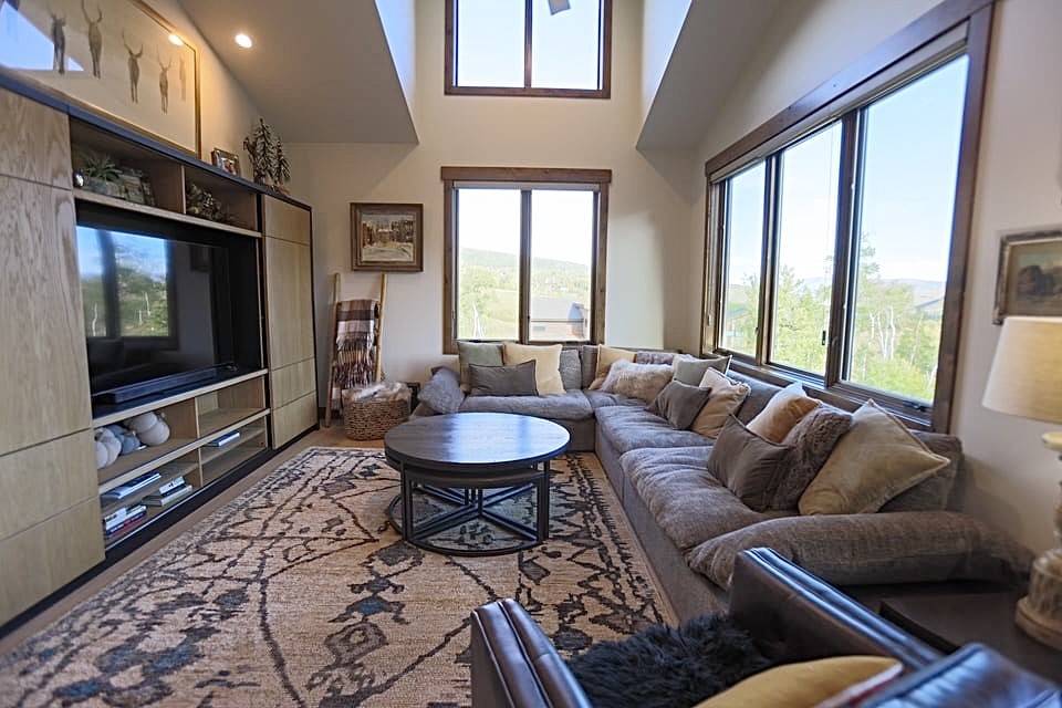 230 Game Trail Road Silverthorne, CO 80498 - Photo 24 of 46 a living room with furniture and a flat screen tv