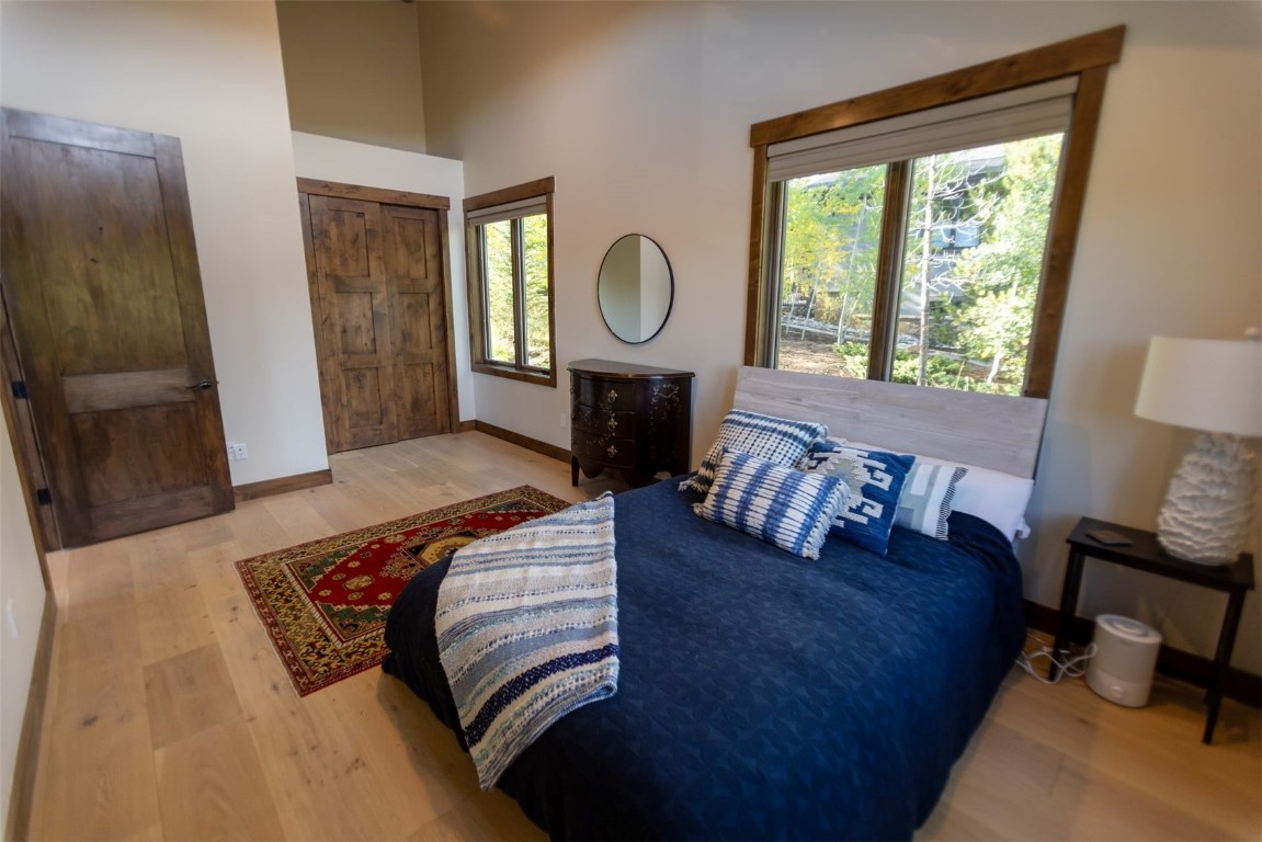 230 Game Trail Road Silverthorne, CO 80498 - Photo 27 of 46 a living room with furniture a lamp a rug and a window