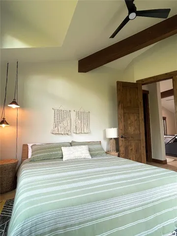 a bedroom with a bed and a walk in closet