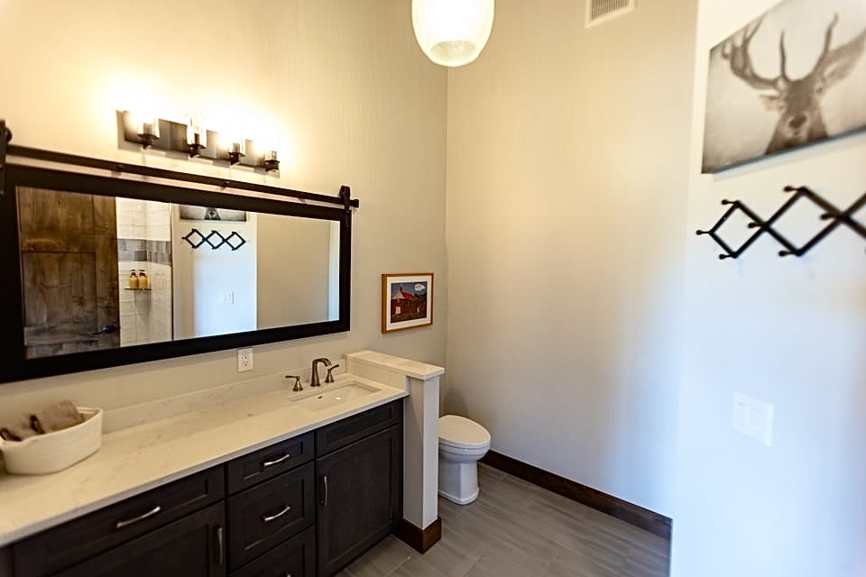 230 Game Trail Road Silverthorne, CO 80498 - Photo 33 of 46 a bathroom with a sink and a mirror
