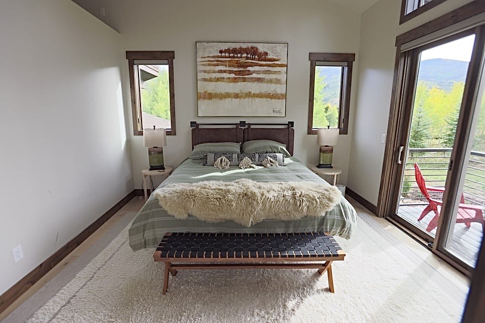 230 Game Trail Road Silverthorne, CO 80498 - Photo 35 of 46 a bed sitting in a bedroom next to a window