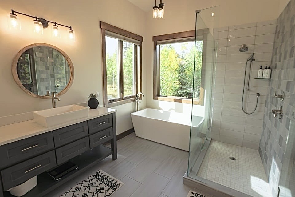 230 Game Trail Road Silverthorne, CO 80498 - Photo 36 of 46 a bathroom with a sink mirror bathtub and shower