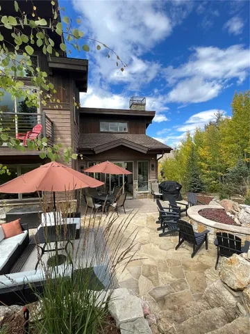 a view of a backyard with sitting area