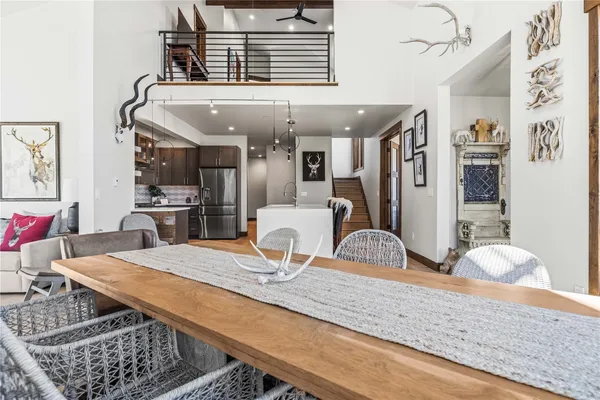 a kitchen with stainless steel appliances granite countertop a stove refrigerator and cabinets
