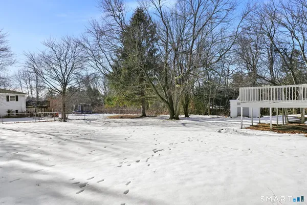 a view of a house with a snow in the yard