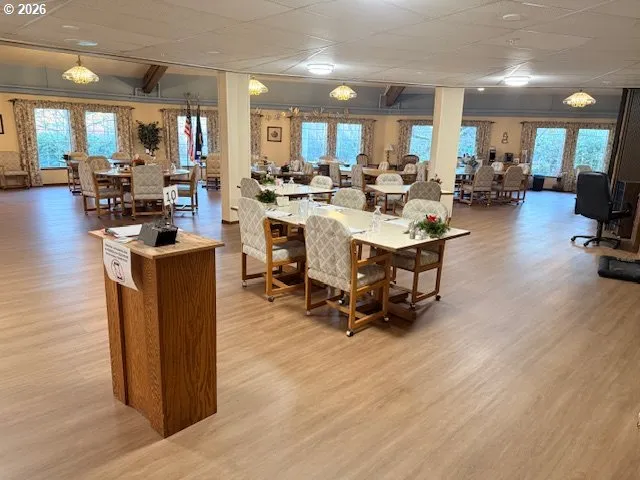 a room with lots of chairs and mirrors