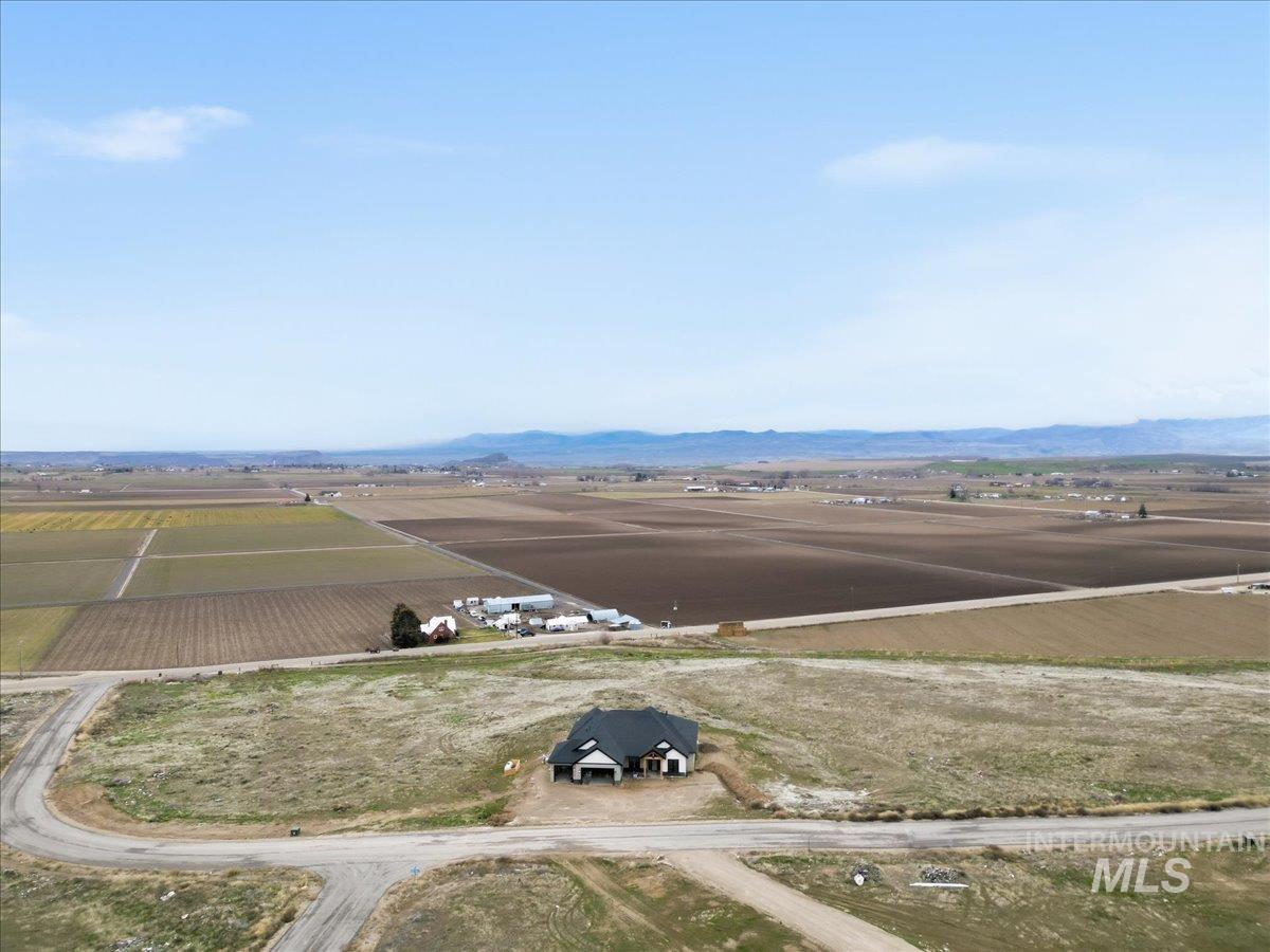 6431 Raptor Ridge Lane Melba, ID 83641 - Photo 4 of 49 Back of property featuring a patio area and roof with shingles