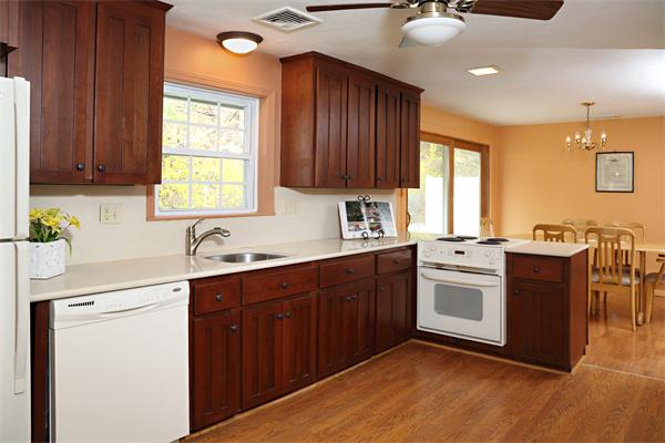 6 Marina Road Chelmsford, MA 01824 - Photo 3 of 7 a kitchen with stainless steel appliances granite countertop wooden cabinets a sink and a stove