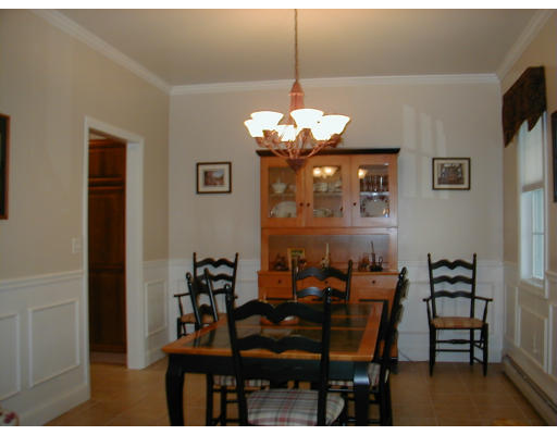 44 Little Turnpike Road Shirley, MA 01464 - Photo 4 of 10 a view of a dining room with furniture and chandelier