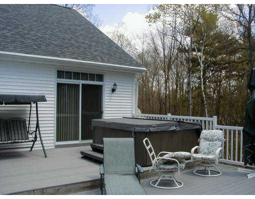 44 Little Turnpike Road Shirley, MA 01464 - Photo 9 of 10 a view of a patio with table and chairs with wooden fence