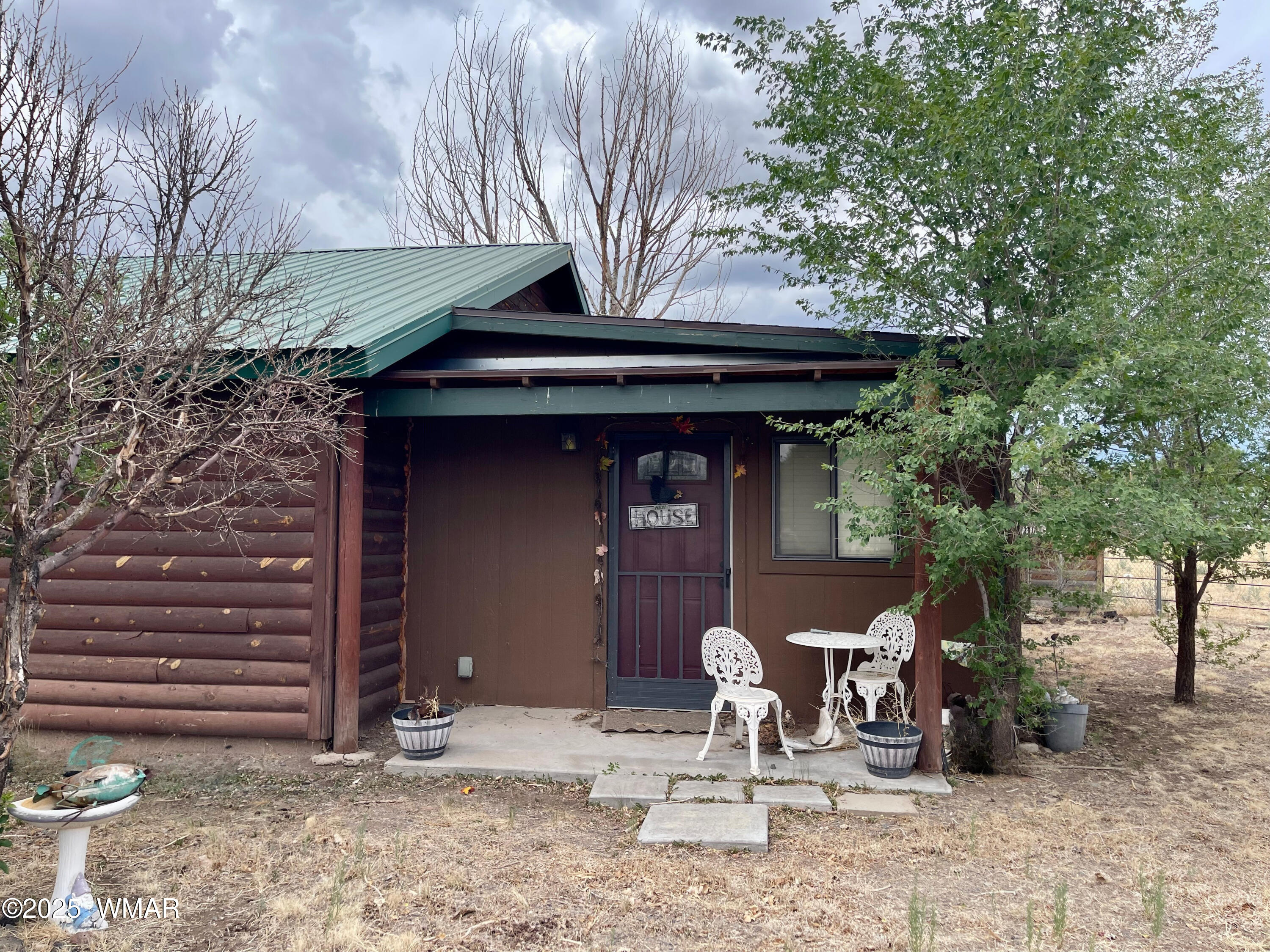 183 North Becker Lake Road Springerville, AZ 85938 - Photo 32 of 41 a front view of a house with garden