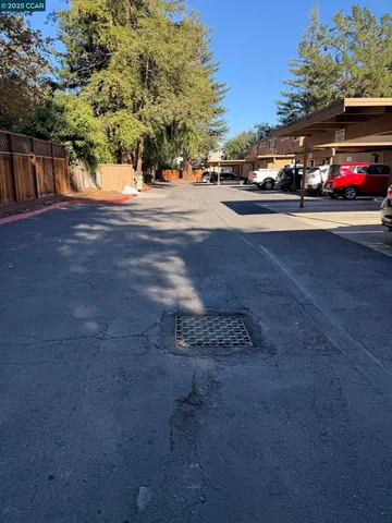 a view of street with parked cars