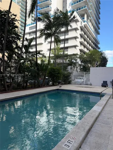 a view of a swimming pool with a lake view