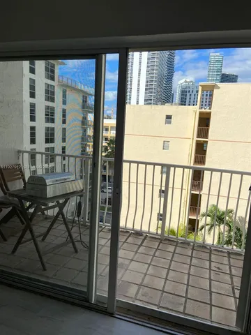 a view of a balcony with chairs