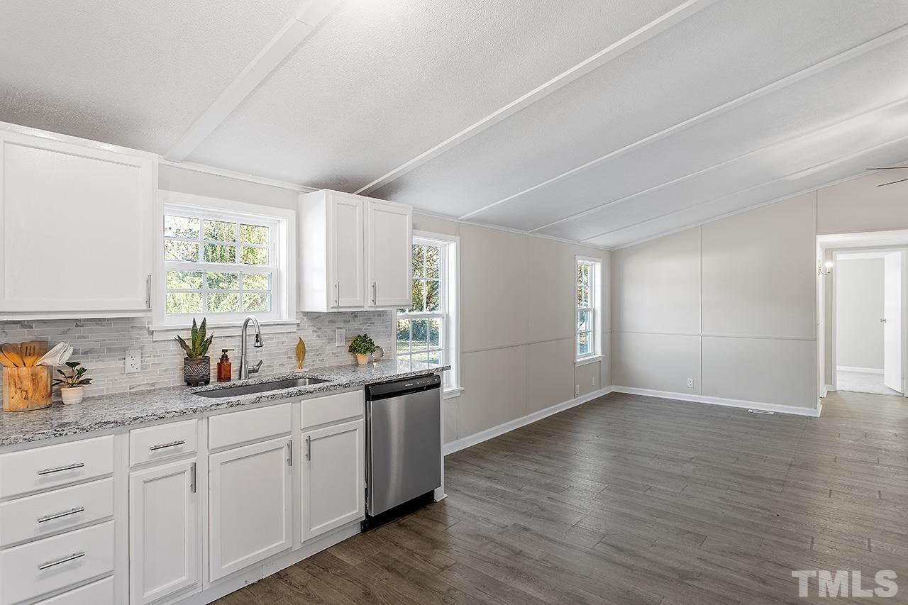 313 Smith Road Smithfield, NC 27577 - Photo 13 of 36 a kitchen with a sink wooden floor and window