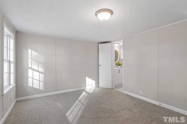 a view of a room with window and cabinet
