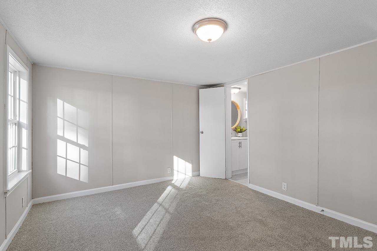 313 Smith Road Smithfield, NC 27577 - Photo 24 of 36 a view of a room with window and cabinet