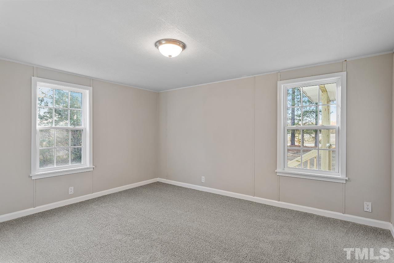 313 Smith Road Smithfield, NC 27577 - Photo 25 of 36 an empty room with a window