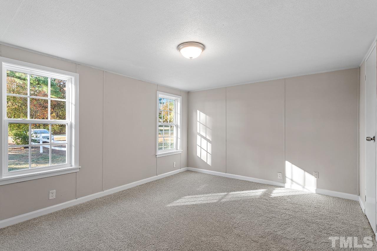 313 Smith Road Smithfield, NC 27577 - Photo 26 of 36 a view of empty room with window