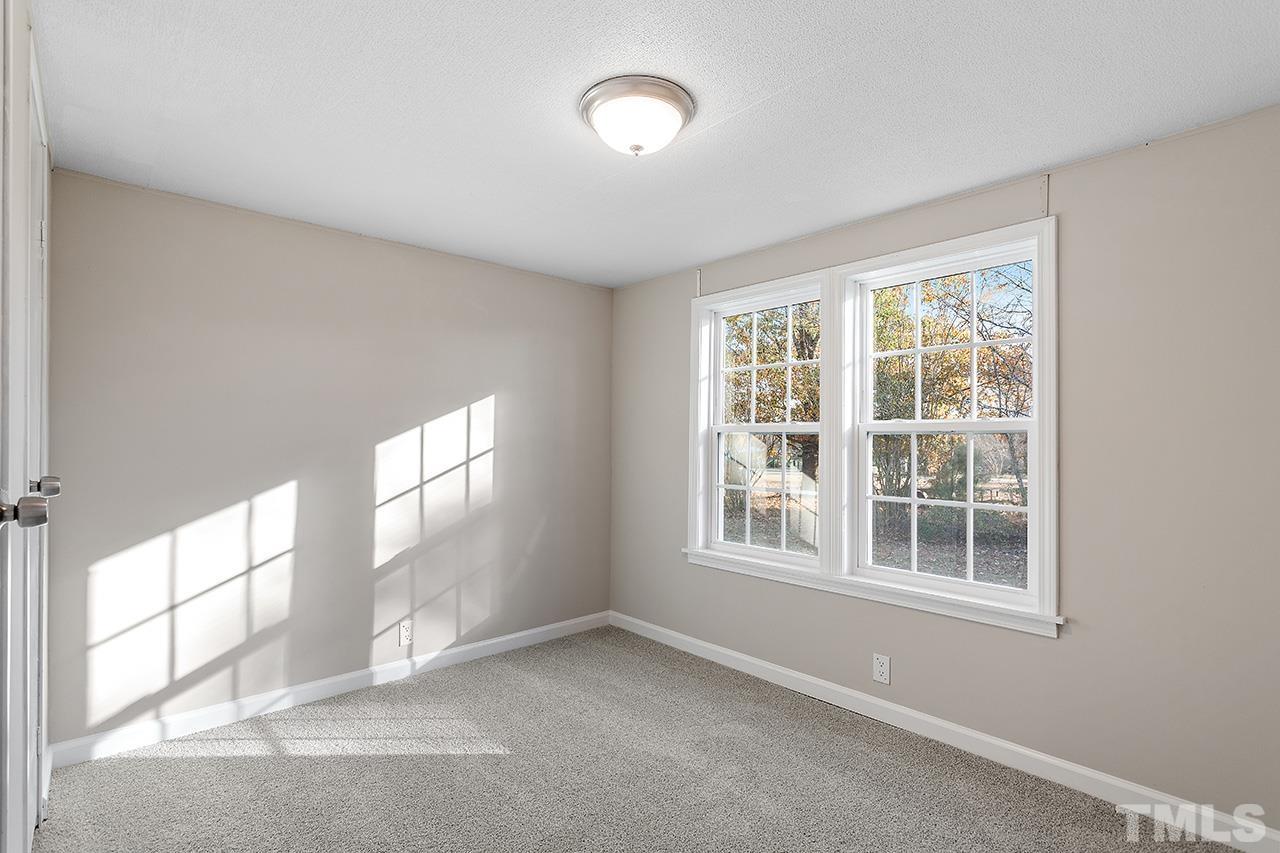 313 Smith Road Smithfield, NC 27577 - Photo 27 of 36 an empty room with a window