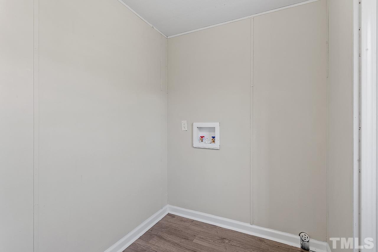 313 Smith Road Smithfield, NC 27577 - Photo 30 of 36 a view of a small space with wooden floor