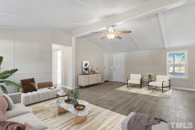 a living room with furniture or couch and a dining table with wooden floor