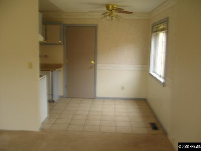 540 Wellington Way Reno, NV 89506 - Photo 4 of 8 an empty room with a empty space and windows