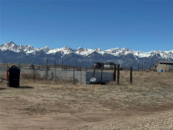 a view of a house with a mountain yard