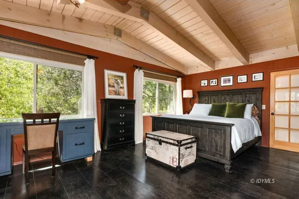a bed room with a bed and a window