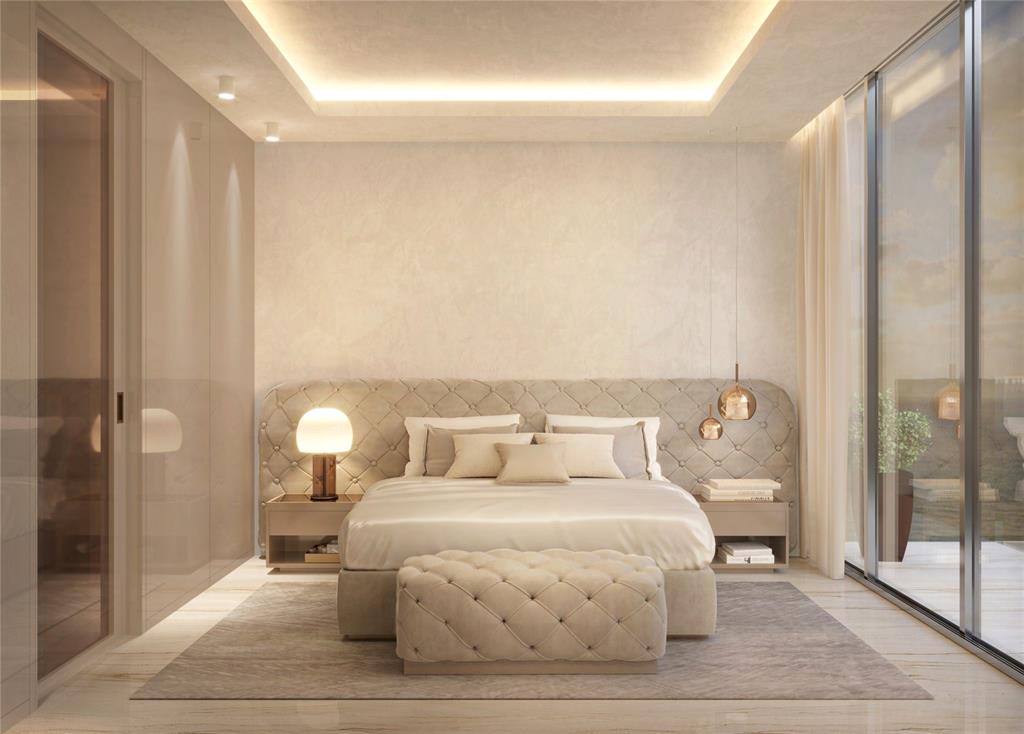 3319 North Ocean Drive, Unit 702 Hollywood, FL 33019 - Photo 14 of 23 a bedroom with a bed and a mirror