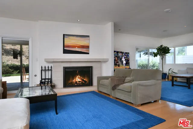 a view of a livingroom with furniture and a dining table