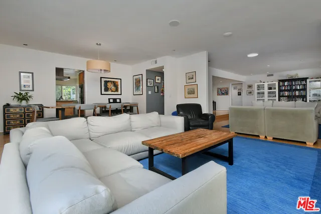 a kitchen with stainless steel appliances granite countertop a stove refrigerator and microwave