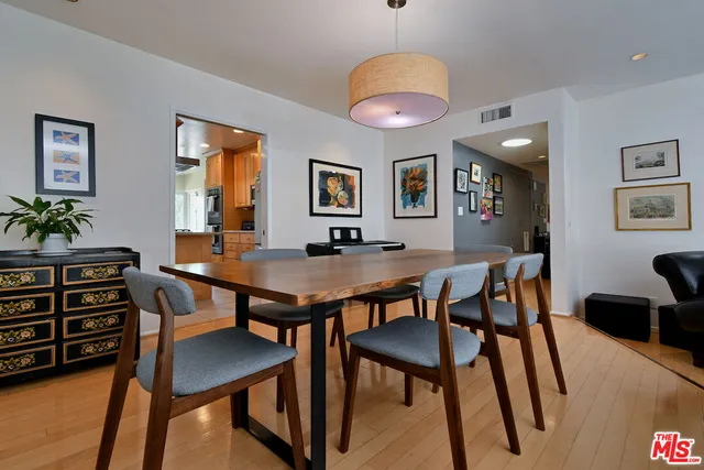 a view of a dining room with furniture and a window
