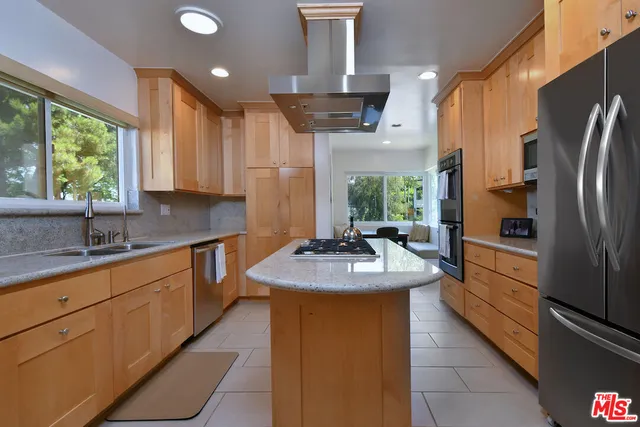 a view of a dining room with furniture and a window