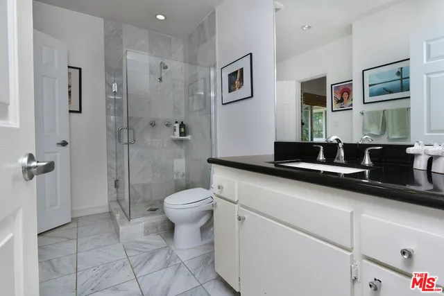 a bedroom with bed and a window