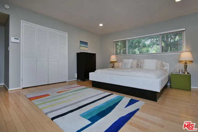 a spacious bathroom with a granite countertop sink mirror and double