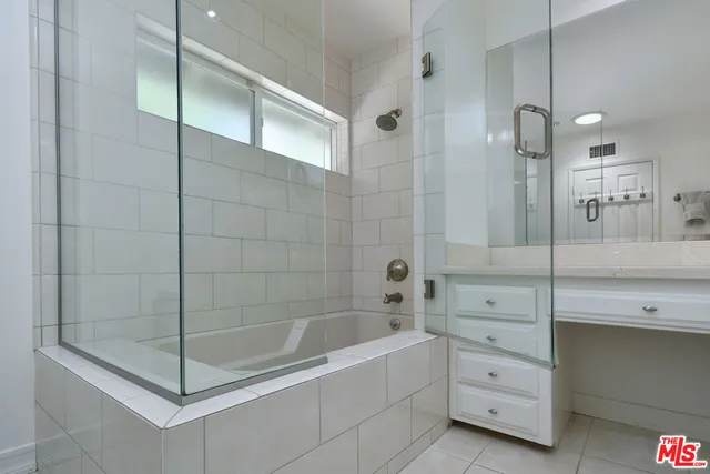 a view of a backyard with plants and patio