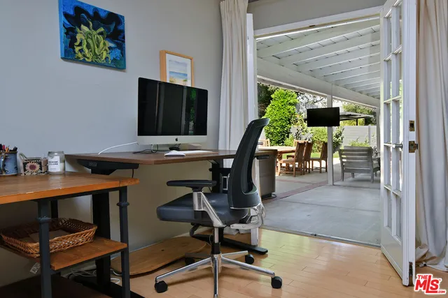 a patio with table and chairs
