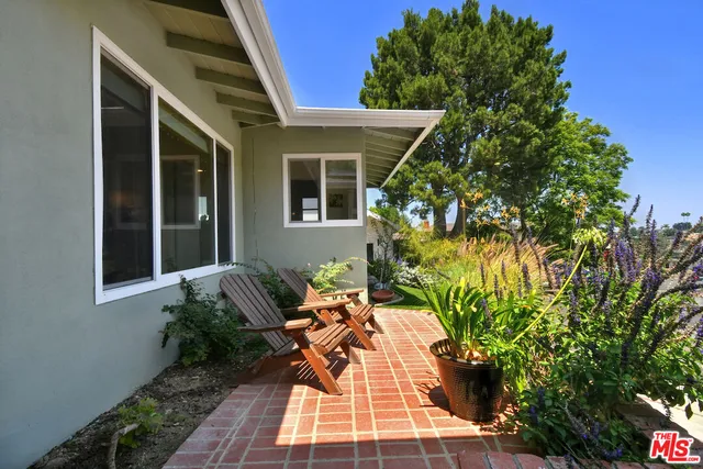 a living room with fireplace furniture and a flat screen tv