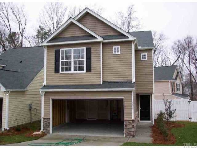 a front view of a house with yard