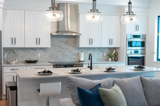 a spacious bathroom with a double vanity sink a large mirror and a bathtub