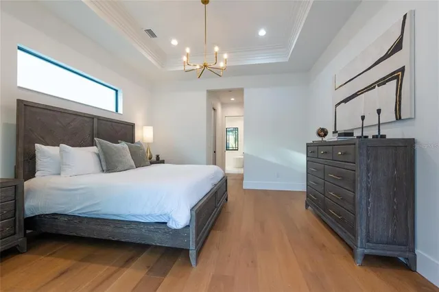 a en suite bathroom with a granite countertop sink toilet and mirror