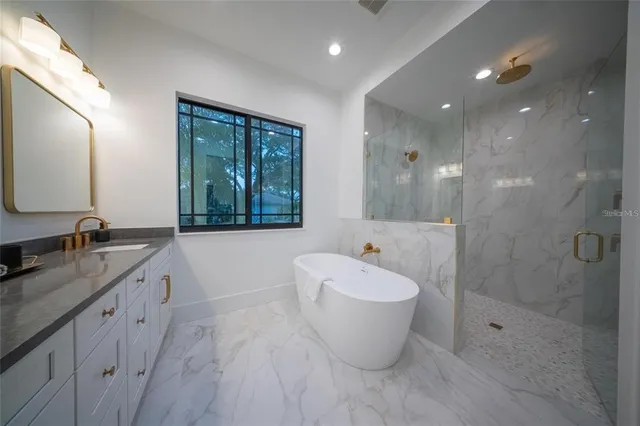 a bedroom with two beds and painting on the wall